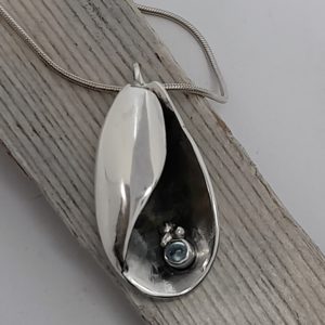 Silver Canoe Shell Pendant with Blue Topaz