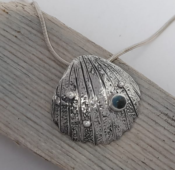 Textured Silver Cockle Shell Pendant with Topaz